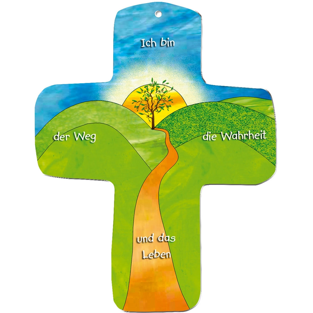 Illustration eines metALUm Wandkreuzes: ein gewundener orangefarbener Weg führt zu einem Baum auf einem Hügel bei Sonnenaufgang. Mit deutschem Text: "Ich bin der Weg die Wahrheit und das Leben" - das Kreuz als Geschenk und Brot des Lebens.