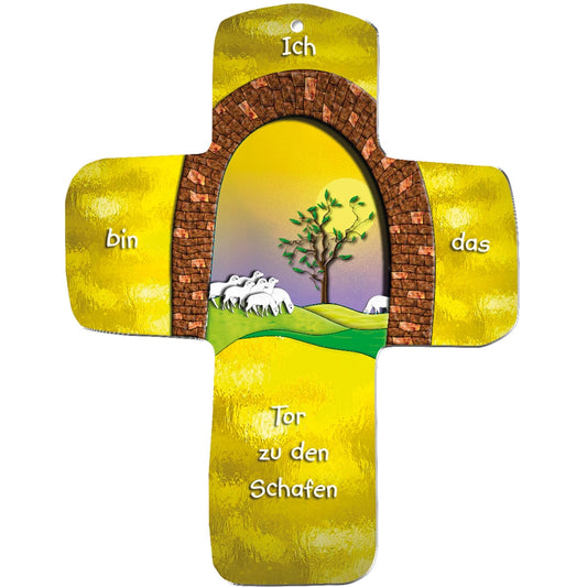Ein metALUm gelbes Wandkreuz zeigt einen Ziegelbogen, der eine grüne Landschaft mit Baum und Schafen einrahmt, mit dem Text "Ich bin das Tor zu den Schafen". Der gelb-lilafarbene Hintergrund macht es zu einem sinnvollen Geschenk für Kinder.