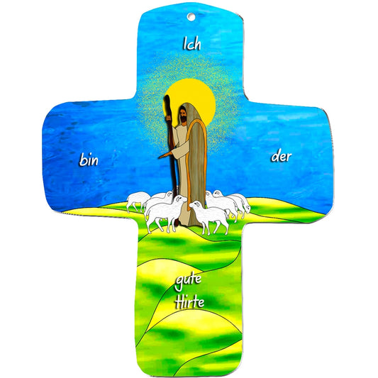 Das metALUm MDF Wandkreuz zeigt Jesus als Hirte mit Stab und weißen Schafen auf grünen Hügeln, einen goldenen Heiligenschein auf dem Kopf und die Inschrift "Ich bin der gute Hirte" über diesem einzigartigen Geschenk.